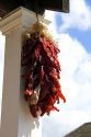 Dried chili peppers hang from a store front at Old Town, San Diego, California.