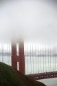 A view of the Golden Gate Bridge and fog in San Francisco, California.