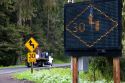 Radar operated digital road sign warning motorists of sharp turns on U.S. 101 north of Eureka, California.