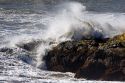 Waves crash on rocks at Crescent City on the California coast.