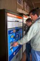 Men purchasing metro cards from a ticket vending machine for the Metrorail System in Washington, D.C.