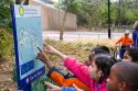 Children point at a map of the National Zoo in Washington, D.C.