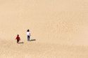 Children play on sand dunes at Nags Head, North Carolina.