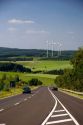 Electricity wind generators and automobiles traveling on the highway in northwest Germany.