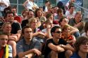 A crowd of soccer fans gather outdoors at the Munich airport watch a 2006 World Cup match on big screen televisions, Germany.