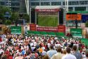 A crowd of soccer fans gather outdoors at the Munich airport watch a 2006 World Cup match on big screen televisions, Germany.