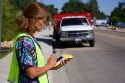 A woman using a handheld GIS device in the field, Boise, Idaho.