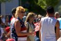 A patriotic woman watching a small town Fourth of July parade in Cascade, Idaho.