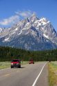 Vehicles travel on the highway through Grand Teton National Park, Wyoming.