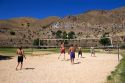 Teens playing beach volleyball at Sandy Point near Boise, Idaho.