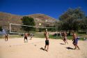 Teens and adults playing beach volleyball at Sandy Point near Boise, Idaho.