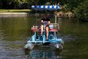 Fifteen year old girl uses a paddlewheel boat on the lagoon in Julia Davis Park, Boise, Idaho.
