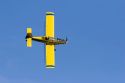 A crop duster spraying a corn field with insecticide west of Danville, Iowa.