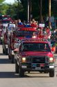 Firemen of Traer, Iowa parade their trucks in the Festival of the Spiral Steps.