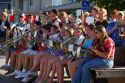 High School  band rides farm wagon during the parade for the festival of the spiral steps at Traer, Iowa.
