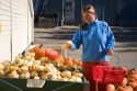 A woman shops for pumpkins at a farmers market in Canyon County, Idaho. MR