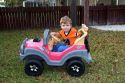 Three year old boy riding in a battery powered toy car. MR