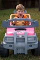 Three year old boy riding in a battery powered toy car. MR