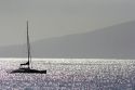 A sailboat on the pacific ocean off the island of Maui, Hawaii.