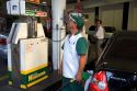 Attendant at a gas station pumping alcohol into a car in Sao Paulo, Brazil.