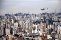 Aerial view of Sao Paulo and a helicopter in flight, Brazil.