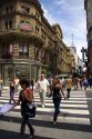 Pedestrians crossing Cordoba street ialong Avenida Floridaq in Buenos Aires, Argentina.