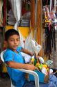 A Brazilian boy selling items on the street in Manaus, Brazil.
