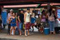 People wait at a bus stop in Manaus, Brazil.