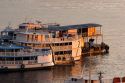 Amazon river boats docked at sunrise in Manaus, Brazil.