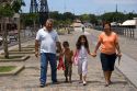 Argentine family walking and holding hands in the La Boca area of Buenos Aires, Argentina.