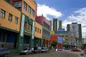 Colorful buildings in the La Boca area of Buenos Aires, Argentina.  Old school at left is an art gallery.
