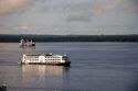Amazon River cruise boat and container ship at Manaus, Brazil.