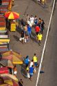 Street vendors and pedestrians on sidewalks in Manaus, Brazil.