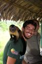 Tourist with a capuchin monkey on his shoulder at a lodge in the Amazon jungle near Manaus, Brazil. MR