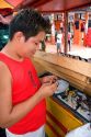 A man selling and repairing watches in Manaus, Brazil.