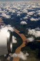 Airplane jet engine and clouds above the Rio Plata delta north of Buenos Aires, Argentina.