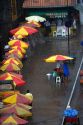 Street vendors with umbrellas in the pouring rain at Manaus, Brazil.