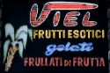 A fruit bar neon sign in Italy.
