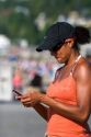 African american woman text messaging on her cell phone in Seattle, Washington. MR