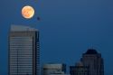 Full moon over the city of Seattle, Washington and the Two Union Square Building.