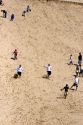 People play on sand dunes at Pacific City on the Oregon Coast.