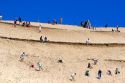 People play on sand dunes at Pacific City Point on the Oregon Coast.