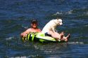 Man with his dog on an inflatable tube floating the Boise River in Boise, Idaho.
