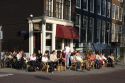 People eat and drink at an outdoor cafe in Amsterdam, Netherlands.