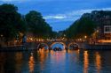 The Amstel River at dusk in Amsterdam, Netherlands.