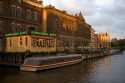 Canal boat tours on the Amstel River in Amsterdam, Netherlands.