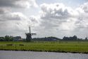 Windmills along a canal east of Leiden in the province of South Holland, Netherlands.