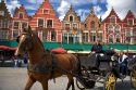 Horse drawn carriage in The Big Market Square at Bruges in the province of West Flanders, Belgium.