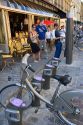 People rent bicycles at a Velib muni-meter as part of the bike transit system in Paris, France.