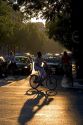 Bicyclists at sunset in Paris, France.